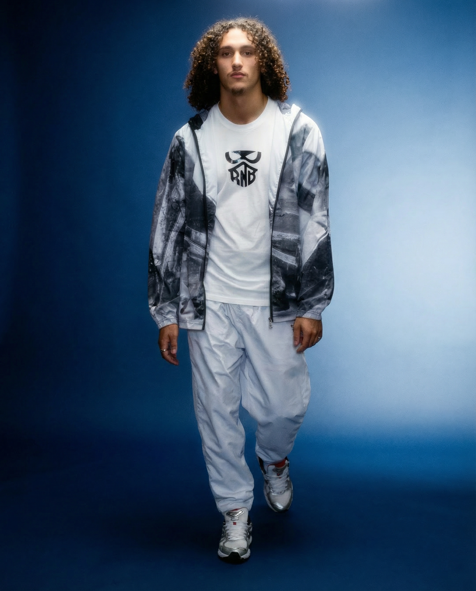 Male wearing track jacket and T-shirt